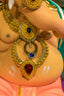 A close up of a person's belly with jewelry on it