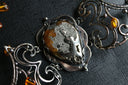A close up of a piece of jewelry on a table
