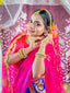 A beautiful bride adorns herself with jewelry.