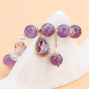 A beautiful purple bead bracelet with charm.