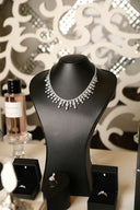 A diamond necklace displays elegantly on a mannequin