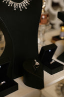 Jewelry is beautifully displayed in black boxes