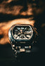 A cartier watch is displayed in close-up.