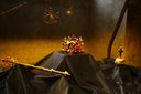 Ornate golden crown and scepter on display