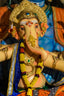 Ganesha idol adorned with flowers and jewelry