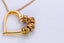 Gold heart pendant necklace with charm beads