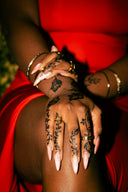 Woman with intricate henna tattoos on hands