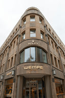 Corner building with rolex and wempe store signs