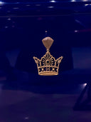 Diamond crown with a gem on a blue background.