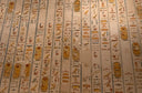 Ancient egyptian hieroglyphs cover a tomb wall.