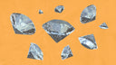 Several sparkling diamonds scattered on orange background