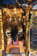 Man walks through a crowded jewelry store.