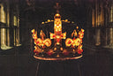 Ornate jeweled crown on display in dark display