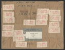Brown paper package covered in vintage red postage stamps.