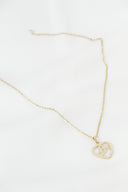 Elegant gold necklace with a heart-shaped pendant