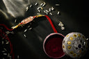 Gold art jewelry: red beaded floral bracelet in velvet box