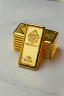 A stack of gold bars sitting on top of a table