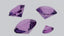 A group of purple diamonds sitting on top of a table