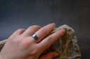 Silver royal jewels ring with engraved pattern on finger