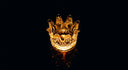 Golden crown jewels candle holder with 18k gold intricate cuts glowing warmly