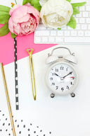 White vintage-style alarm clock with silver accents and black numerals in an article about spotting fine jewelry in Everett