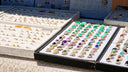 Jewelry rings displayed on a table, awaiting customers.