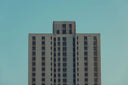 white and brown concrete building under blue sky during daytime