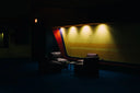 Dark leather recliners in a dim room with warm lighting highlighting jacob & co luxury jewelry design elements