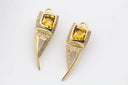 Gold-toned fine jewelry earrings with geometric design, faceted yellow gemstones, and pavé-set diamonds for tailored elegance