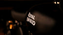 Black royal enfield motorcycle fuel tank with white royal enfield logo featured in thrilling tales of royal jewels.