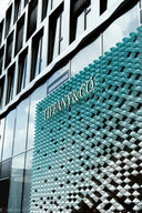 Tiffany & co. store front with unique textured wall.