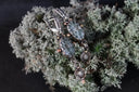 Timeless heirloom 18k gold jewelry: silver drop earrings with blue-gray gems