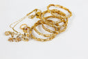 18k art gold jewelry collection with bangles, necklaces, elegant gems
