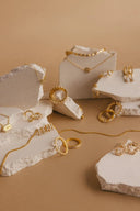 Gold-toned 18k gold jewelry ring with textured beaded edge and smooth inner band showcasing fine jewelry elegance.