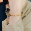 Gold-toned paperclip-style chain bracelet showcasing unique gold chain styles in art gold jewelry trends for millennials