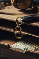 a close up of a pair of scissors and a keychain