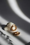 Gold hoop earrings with pearl attachments in jewelry speaks volumes style