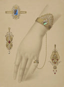 A gold-toned art deco bracelet with green gemstone and diamonds showcasing fine gold jewelry craftsmanship.