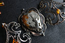Silver wire-wrapped victorian jewelry necklace with amber and metallic mineral pendant inspired by 18k gold jewelry trends