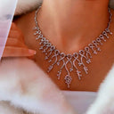 Intricate diamond necklace with delicate branching design on 14k gold box chain