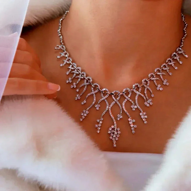 Intricate diamond necklace with delicate branching design on 14k gold box chain