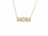 Close view of the MOM pendant, each letter pavé set with small round diamonds, the chain joining the outer edges of the two M's