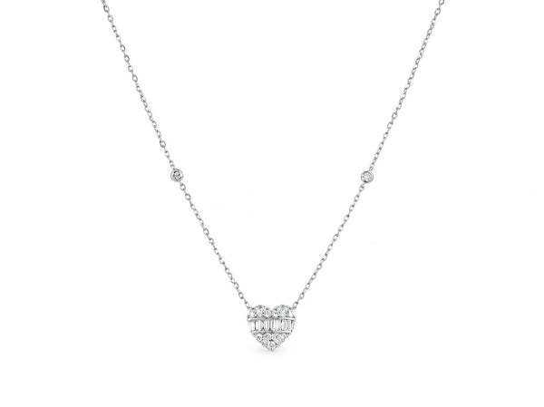 The same diamond heart necklace shown wider in the frame, the chain forming a V with a bezel-set diamond on each side and the heart at the lower point.