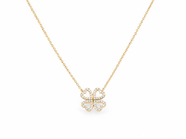 14K yellow gold clover necklace laid out with the four leaf pendant at the centre, each leaf an open heart outline lined with small lab grown diamonds