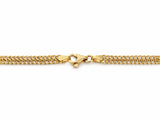 Macro detail of the lobster clasp and end caps on the gold chain necklace
