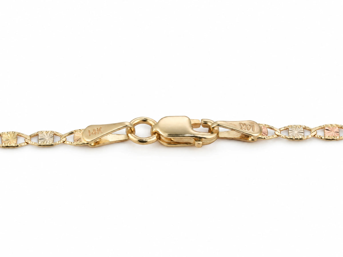 Lobster claw clasp with two flat end tags stamped 14K on the piastrine chain