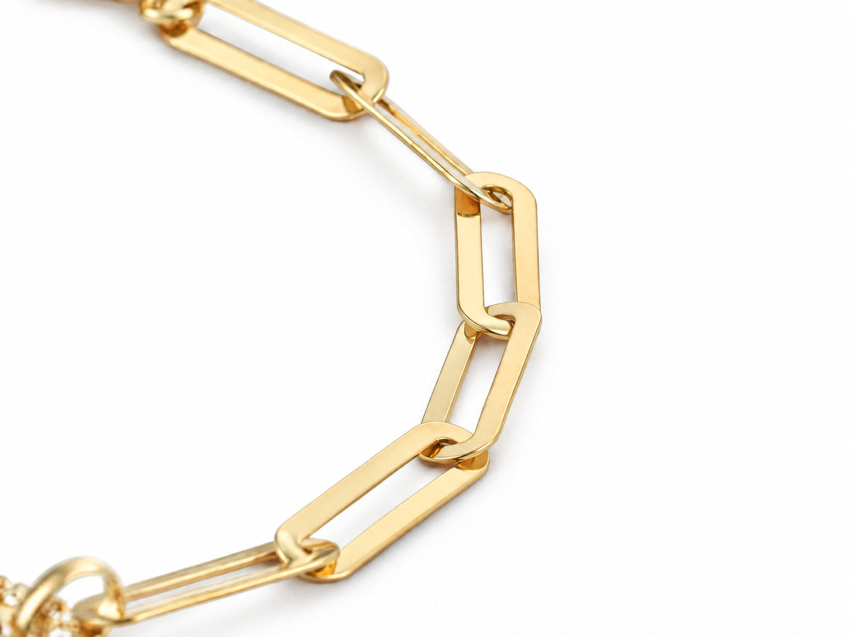 Macro of the gold paperclip links of the bracelet