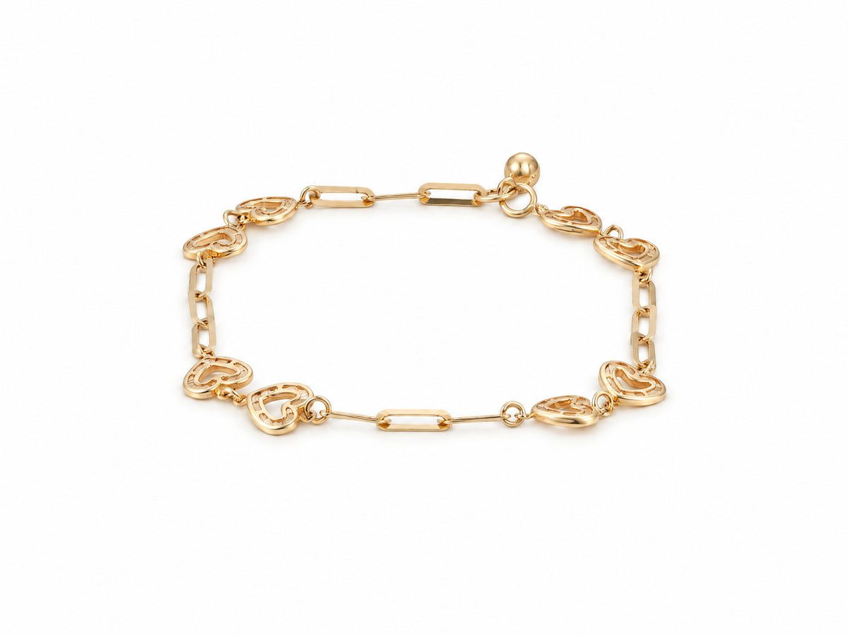Gold heart link bracelet laid flat, alternating open heart and elongated links