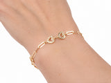 Gold heart link bracelet worn on the wrist, seen from above