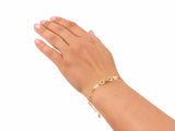 Gold heart link bracelet worn on the wrist, second view